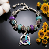 Close-up of Suicide Awareness Charm Bracelet showing 12 silver, teal, and purple Pandora-style charms