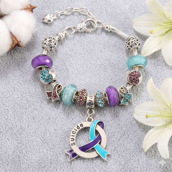 Suicide Awareness Luxury Charm Bracelet with teal and purple charms on white background – The Awareness Store