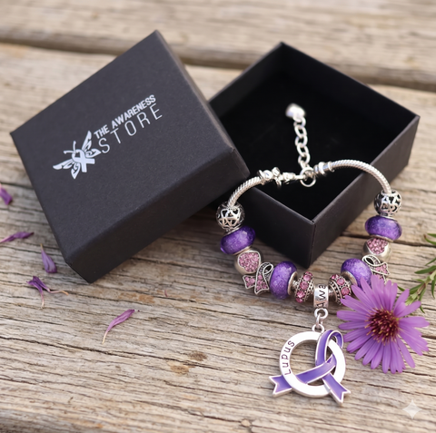 Silver snake chain bracelet with purple glass beads and a central Lupus Awareness ribbon charm